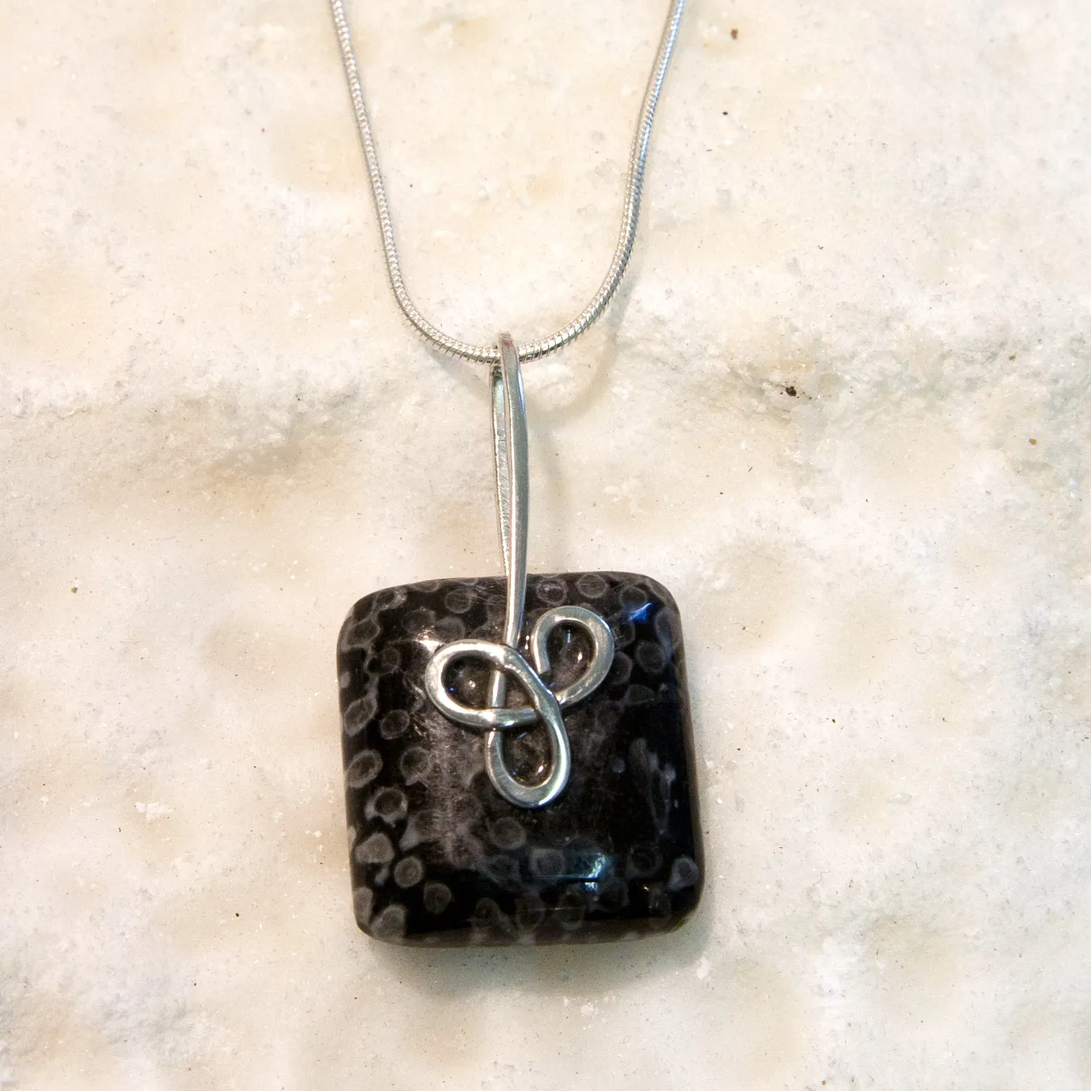 FC29P Fossilised Coral Square Pendant with Sterling Silver Trinity Knot